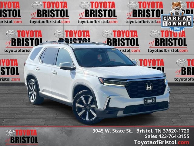 2023 Honda Pilot Elite in Platinum White Pearl — front three-quarter view